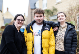 Image of 3 people smiling for the camera